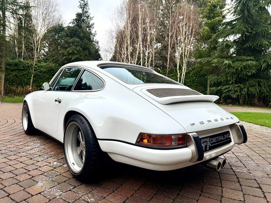 Singer Porsche 911 restoration and paint correction by FX Detailing. Total vehicle reset featuring deep-cleaned wheel arches, polished exhaust tips, and ceramic protection in Surrey.