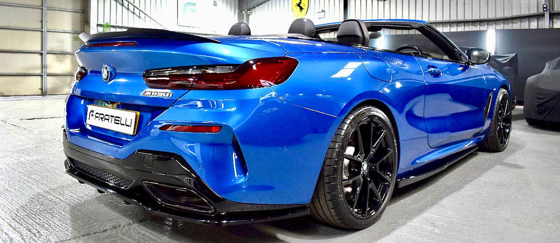 BMW 8-Series Gran Coupe receiving a full carbon fibre bodykit and ceramic coating at FX Detailing Surrey. Image shows the front splitter and side skirt fitment in our Charlwood studio.