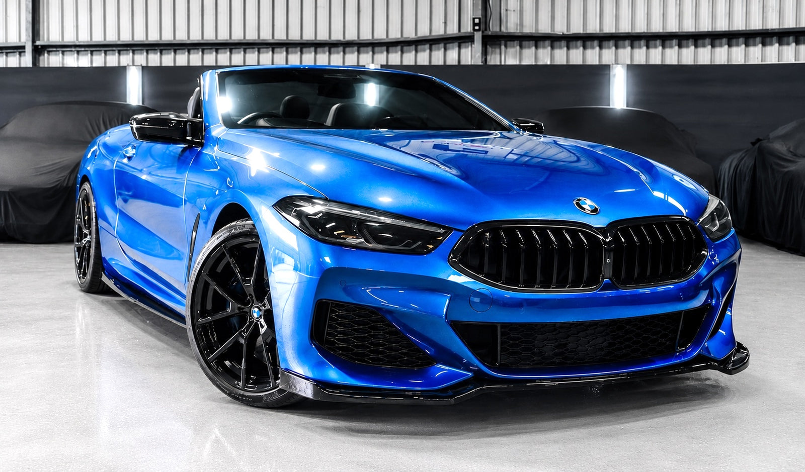 Blue BMW 8 Series convertible after bodykit installation by FX Detailing