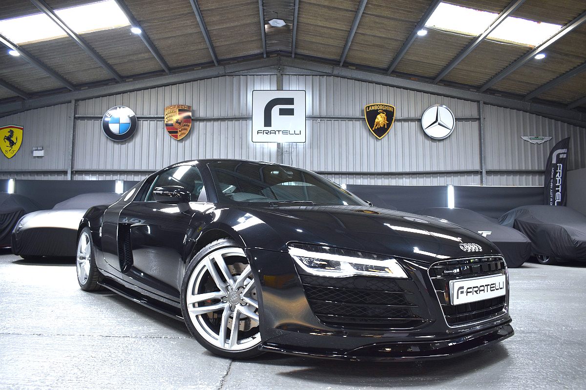 Black Audi R8 with a front splitter and side skirt
