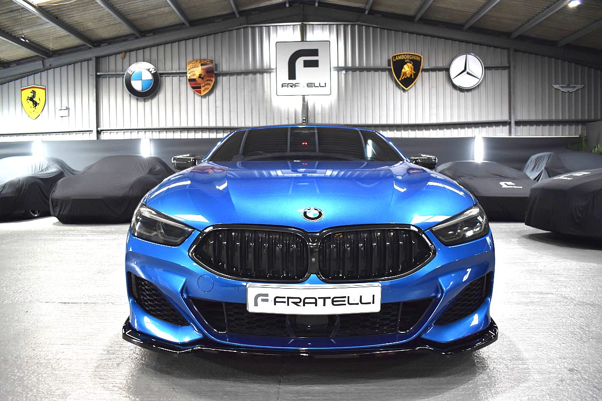 Front of a blue BMW 850i with a front splitter