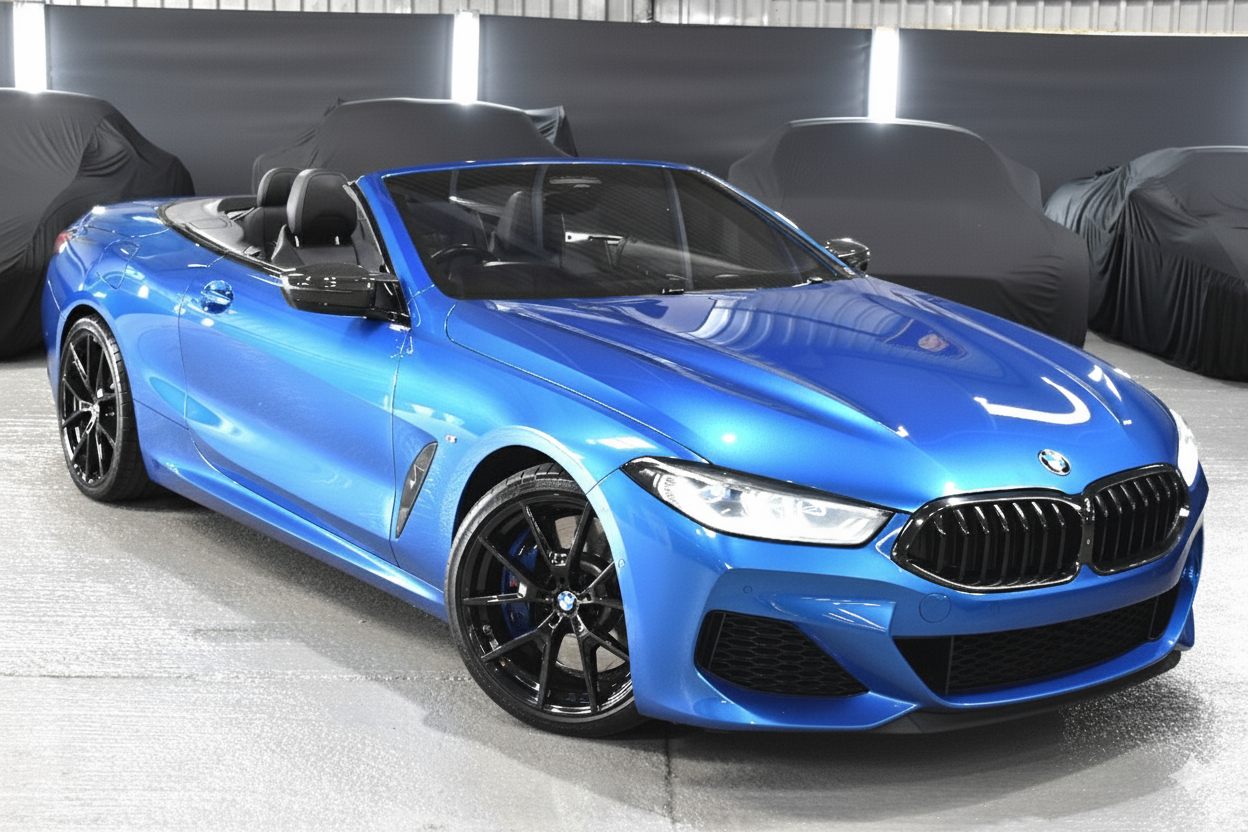 Blue BMW 850i convertible, front three-quarter, before the front splitter and side skirt