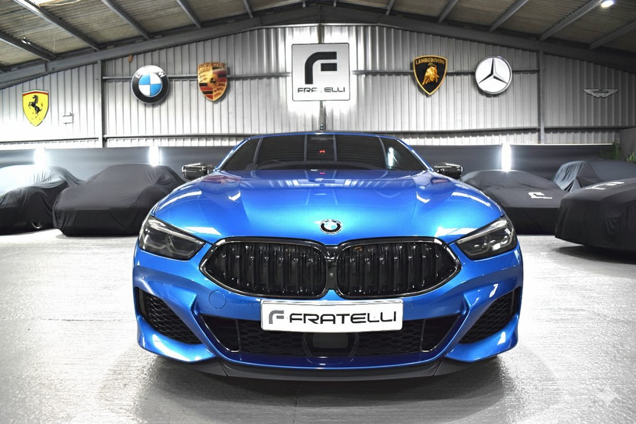 Front of a blue BMW 850i before the front splitter