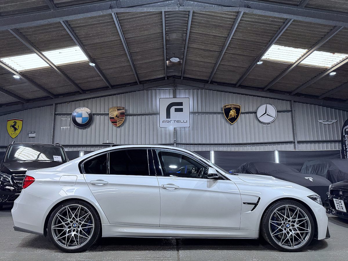 Side of a white BMW M3 saloon with a side skirt
