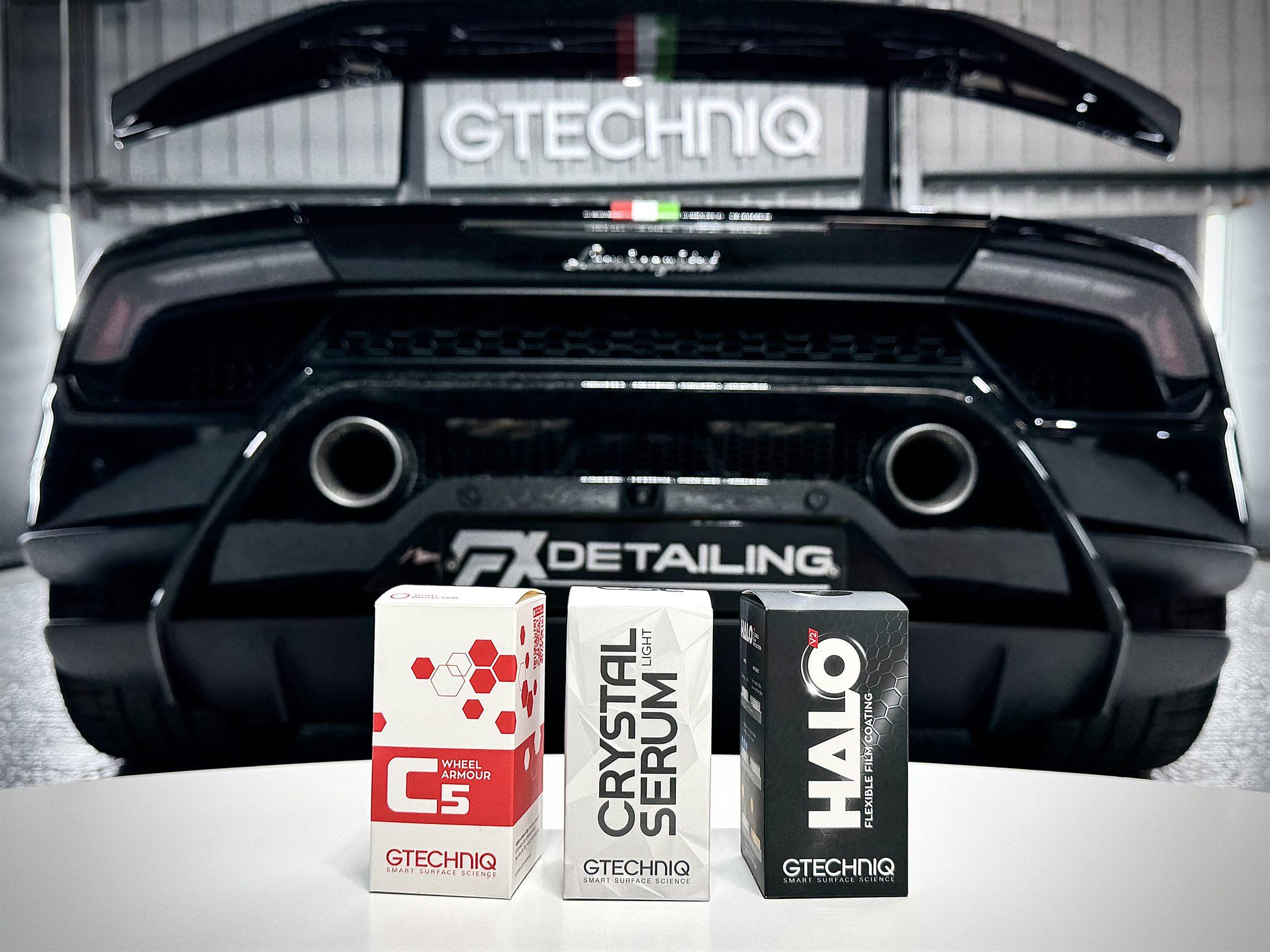 Gtechniq ceramic coating products in front of a black Lamborghini at FX Detailing