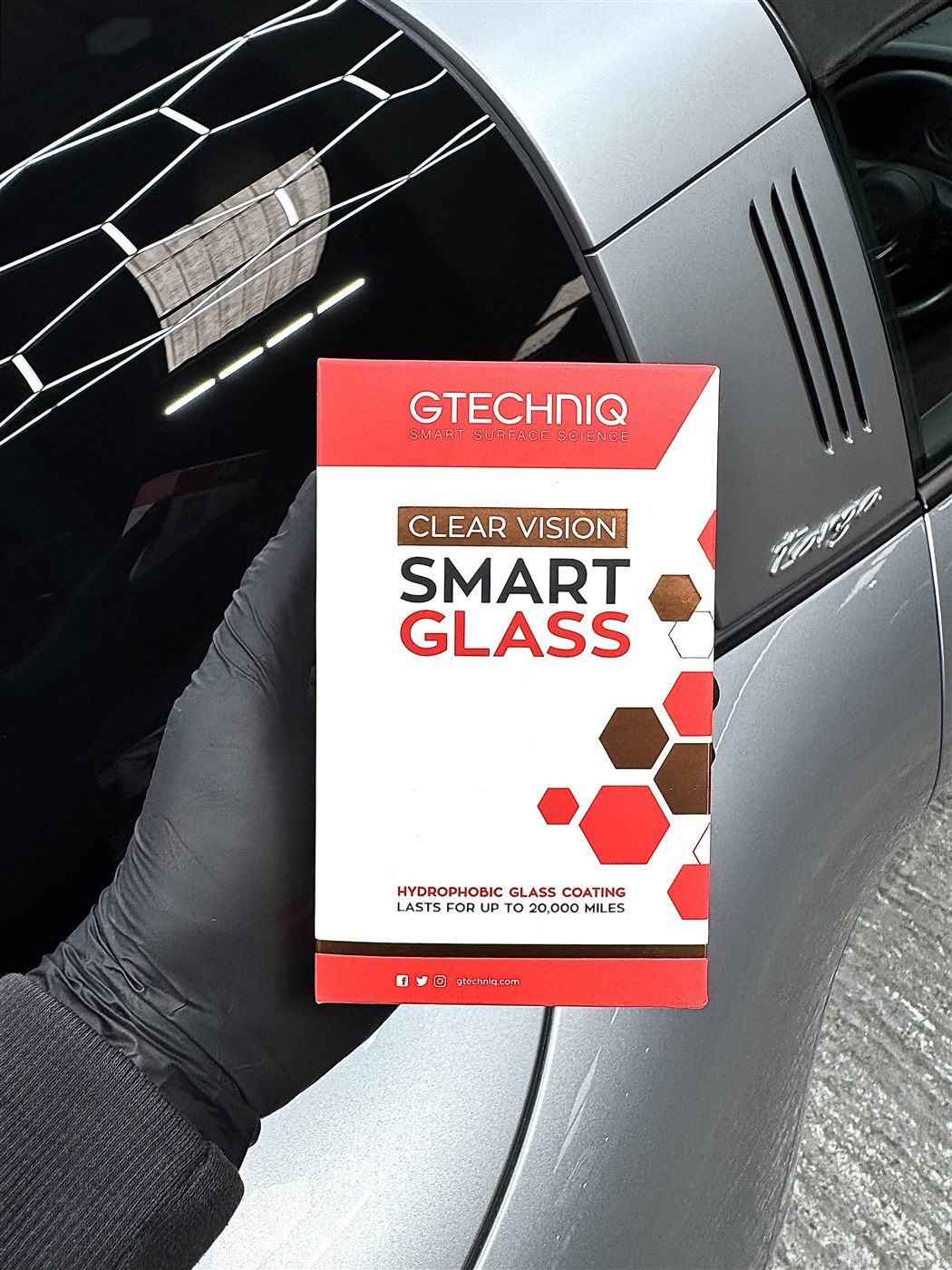 Gtechniq ClearVision Smart Glass box held beside a car window