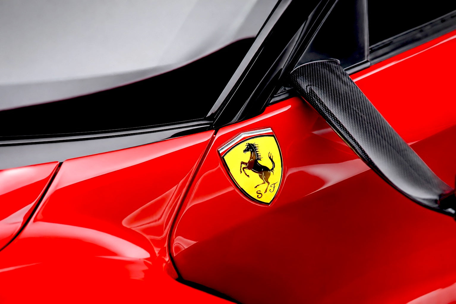 Red Ferrari 488 receiving multi-stage paint correction at FX Detailing Surrey studio