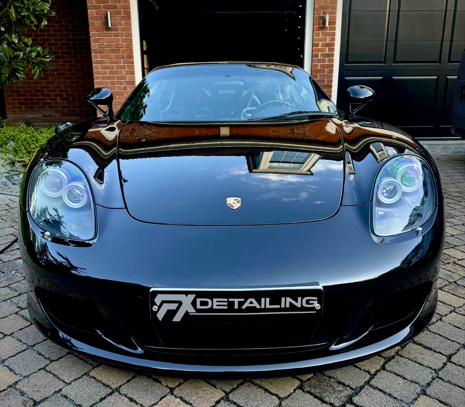 Black Porsche Carrera GT after luxury car detailing by FX Detailing